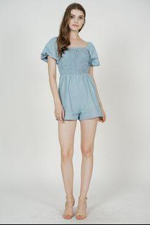 Mds Gwyneth Smocked Denim Romper in Blue