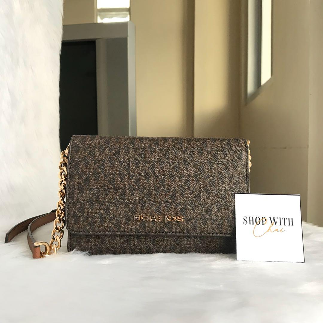 Michael Kors Wallet On Chain in Brown Signature, Luxury, Bags & Wallets on  Carousell