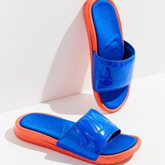 orange and blue nike slides
