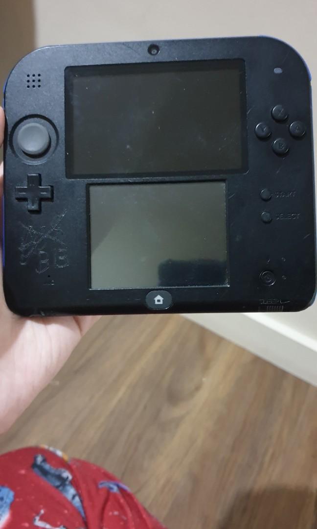 Black with blue design 2ds( nintendo ds) (Category: Nintendo) located in Quezon City. Submitted by itemsforadoption (Listing ID 1057911309, Image 2). Description: Rfs: Coming back from my quarantine break to post more items to sell. I'll probably post more than 50 items over the course of these few days. Item Description: Black with blue sides 3ds *has a lot of markings and scratches but all functions work( unit only, has no charger, memory or st