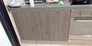 An old kitchen cabinet given a new facelift with new doors