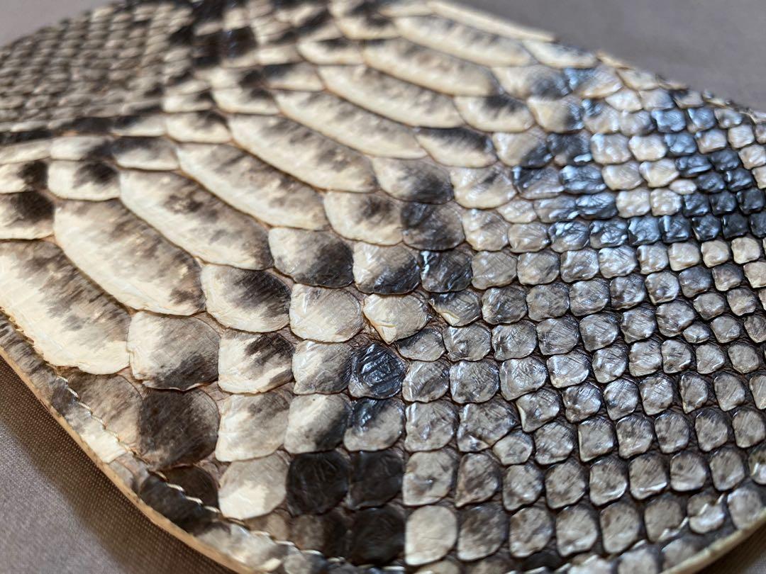 LINGWU Python Clutch (Category: Bags & Wallets) located in Singapore. Submitted by lijiali (Listing ID 1058423614, Image 3). Description: Crafted in python skin. Never used before. Measurements: 18cm (length) x 12cm (depth).