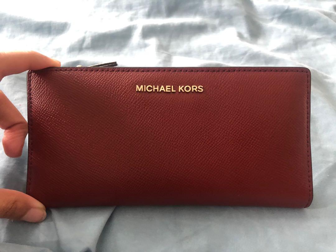 Michael Kors red slim wallet, Women's Fashion, Bags & Wallets, Wallets &  Card holders on Carousell