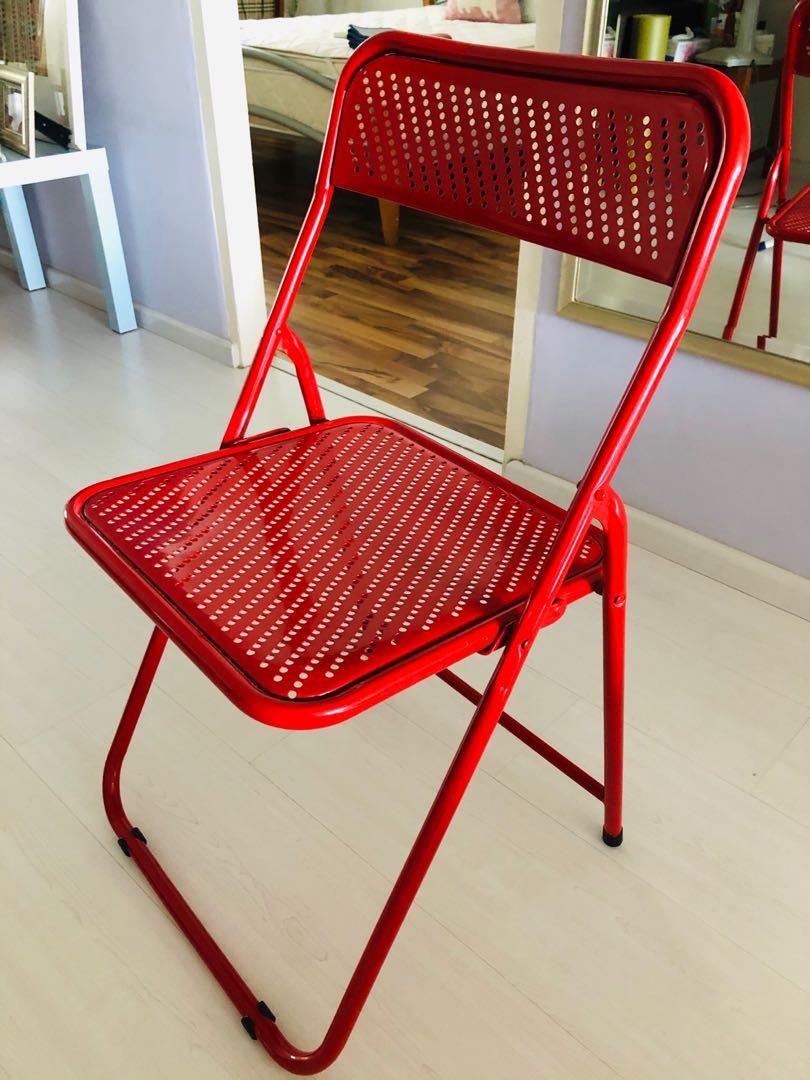 Red metal store chairs