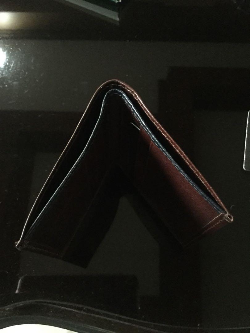 Danier Leather Wallet (Category: Wallets & Card Holders) located in Quezon City. Submitted by lftanco (Listing ID 1059068705, Image 3). Description: Danier pure leather wallet for men in navy blue and dark brown colour. Made and bought in Canada .