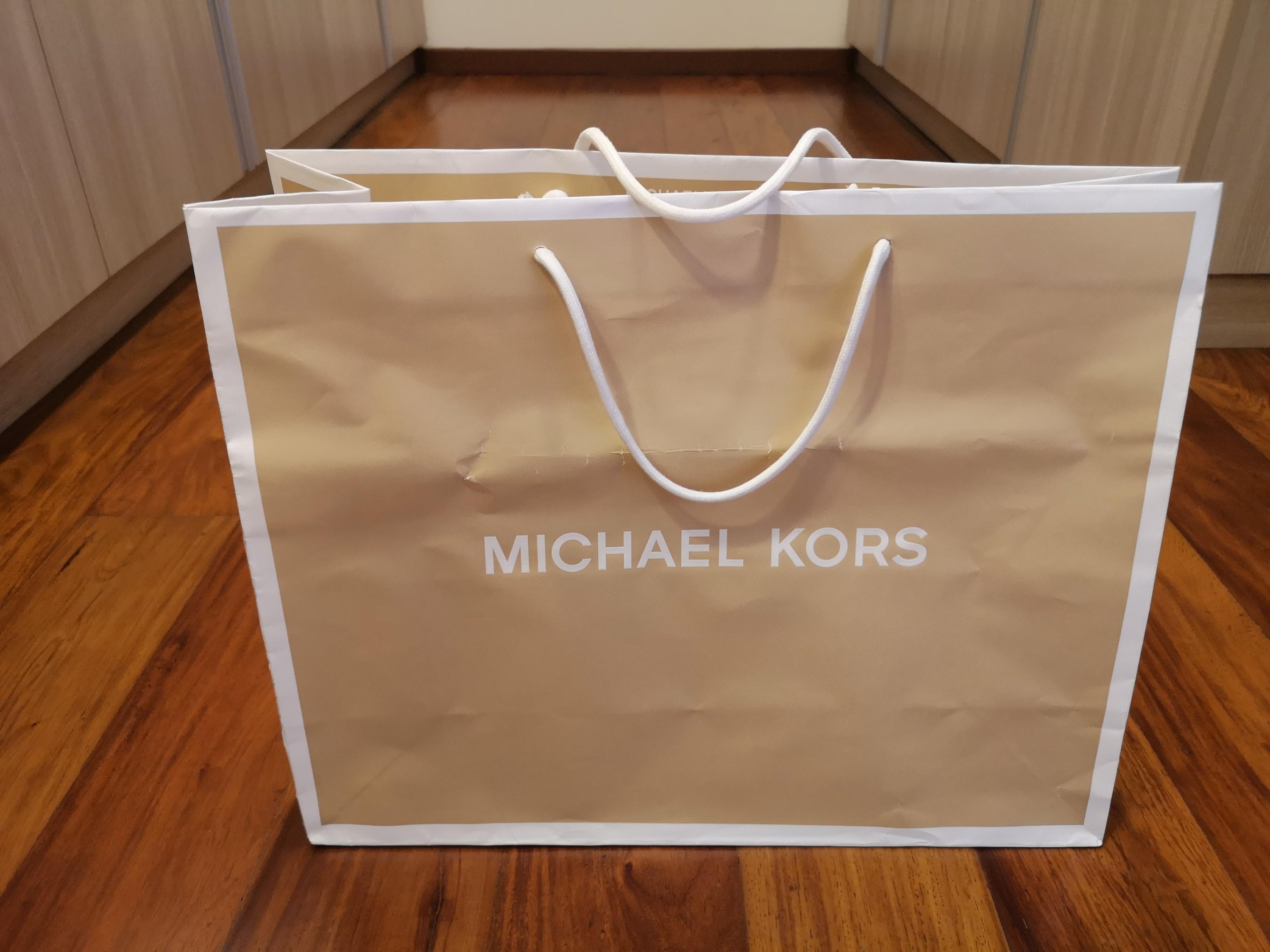 Michael Kors large paper bag (Category: Luxury Bags & Wallets) located in San Juan City. Submitted by super.saver8 (Listing ID 1059065162, Image 2). Description: size 48x38cm with some crumple.