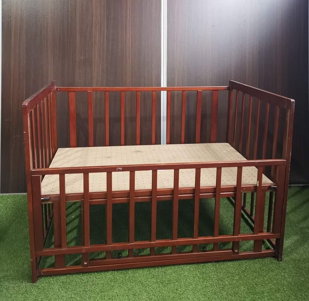 Japan Wooden Crib (Category: Cots & Cribs) located in Valenzuela. Submitted by jgalano1 (Listing ID 1053416150, Image 2). Description: Japan Wooden Crib Condition: Used, good condition, with scratches. Features: adjustable floor board, under compartment. Dimension: 120cm (L), 70cm (W), 80cm (H) Flaw: scratches.
