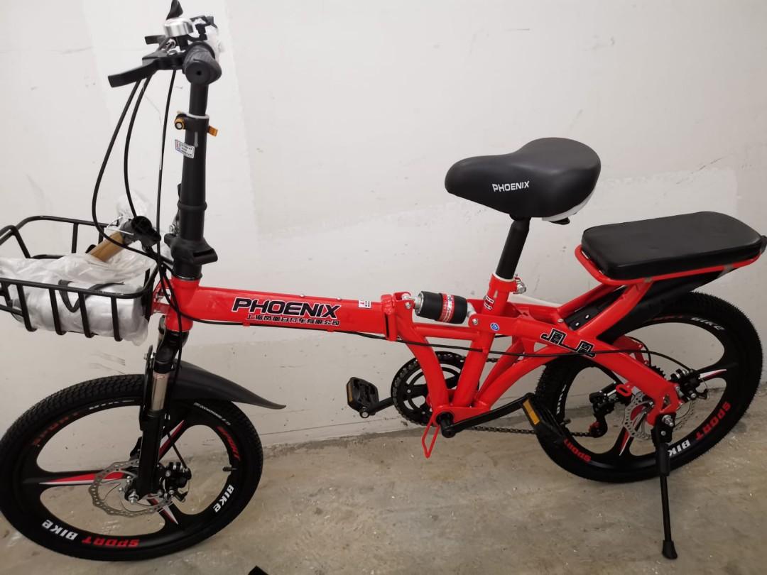 adult on kids bike