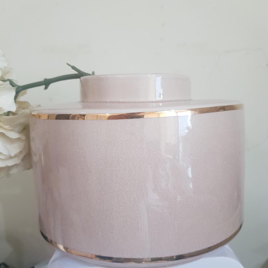 H&M blush pink jar vase (Category: Laundry Baskets) located in Taguig. Submitted by shopsaleph (Listing ID 1053581523, Image 3). Description: H&M blush pink nude with gold accent vase jar. P1100. Like new condition. There is a small gold missing on the line but it was really like that when bought. Inside vase just needs a little cleaning. Bought for P1490. Flower not included..