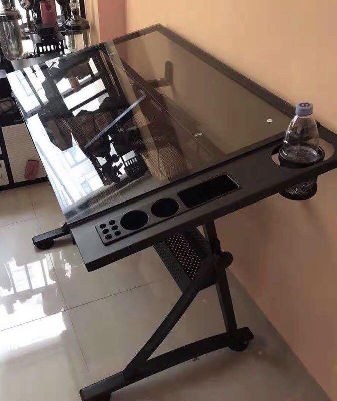 Tempered Glass Drafting Table (Category: Tables & Sets) located in San Pedro. Submitted by draftingtablemaker (Listing ID 1053870678, Image 1). Description: Tempered Glass Drafting Table Imported Unit readily available- limited unit can tilt from flat to 60 degrees free chair.