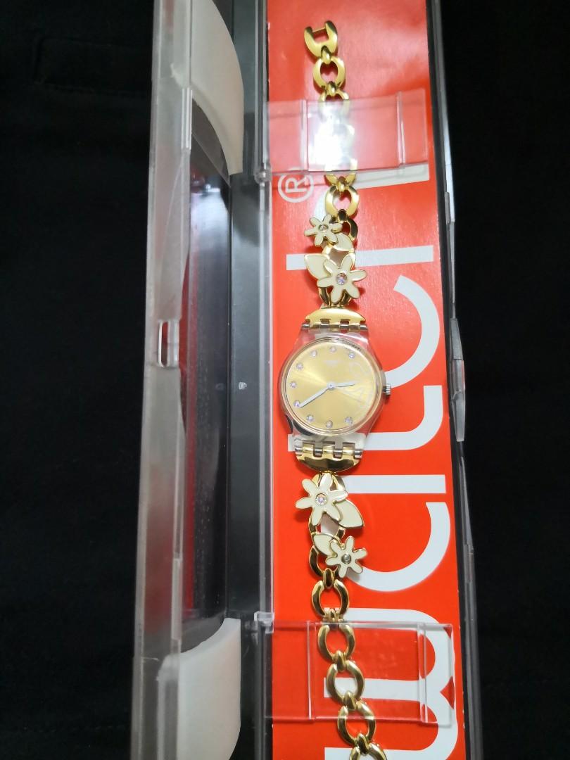 Swatch women's gold watch shop