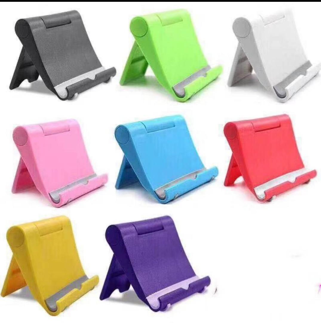 CELLPHONE HOLDER MOBILE STAND (Category: Mounts & Holders) located in Quezon City. Submitted by maica.store (Listing ID 1051217986, Image 2). Description: Product details of UNIVERSAL STENTS MULTI-ANGLE ADJUSTABLE LAZY STAND FOLDING CELLPHONE STAND IPAD STAND PRODUCT NAME: FOLDING CELLPHONE STENTS PRODUCT SIZE:10X8X2cm PRODUCT MATERIAL: PP+NON-SLIP SILICONE COLOR FAMILY : 1.BLACK 2.WHITE 3.BLUE 4.GREEN 5.YELLOW/ORANGE 6.PINK 7.RED 8.PURPLE Plasti