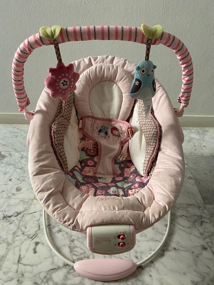 Audrey cradling bouncer in pink new arrivals