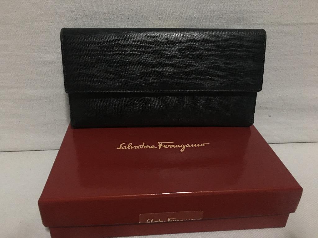Salvatore Ferragamo Long Flap wallet (Category: Luxury Bags & Wallets) located in Quezon City. Submitted by limebasil (Listing ID 1054327704, Image 1). Description: Brand: Salvatore Ferragamo Guaranteed Authentic item or money back. Material: Leather Condition: 8/10; With light scuffing on the side and hardware 6 card slots; 2 inner pockets; 1 outer pocket for bills or coins Comes with box and card .