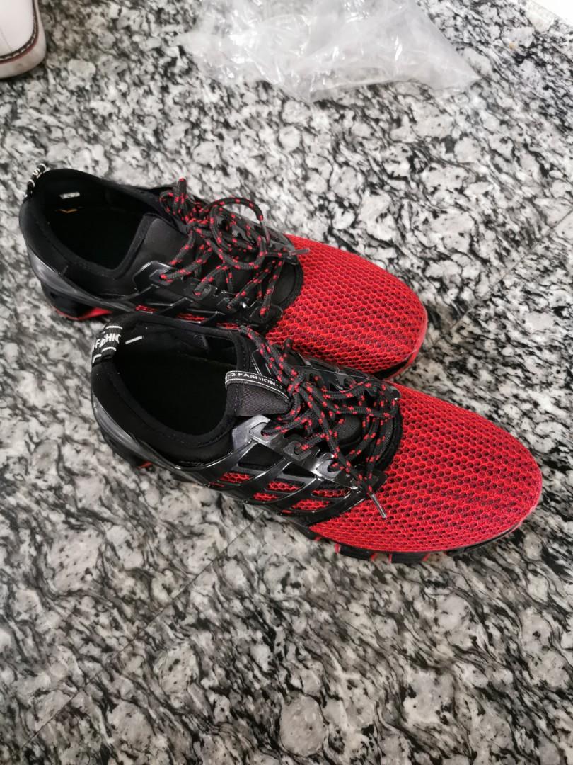 red and black gym shoes