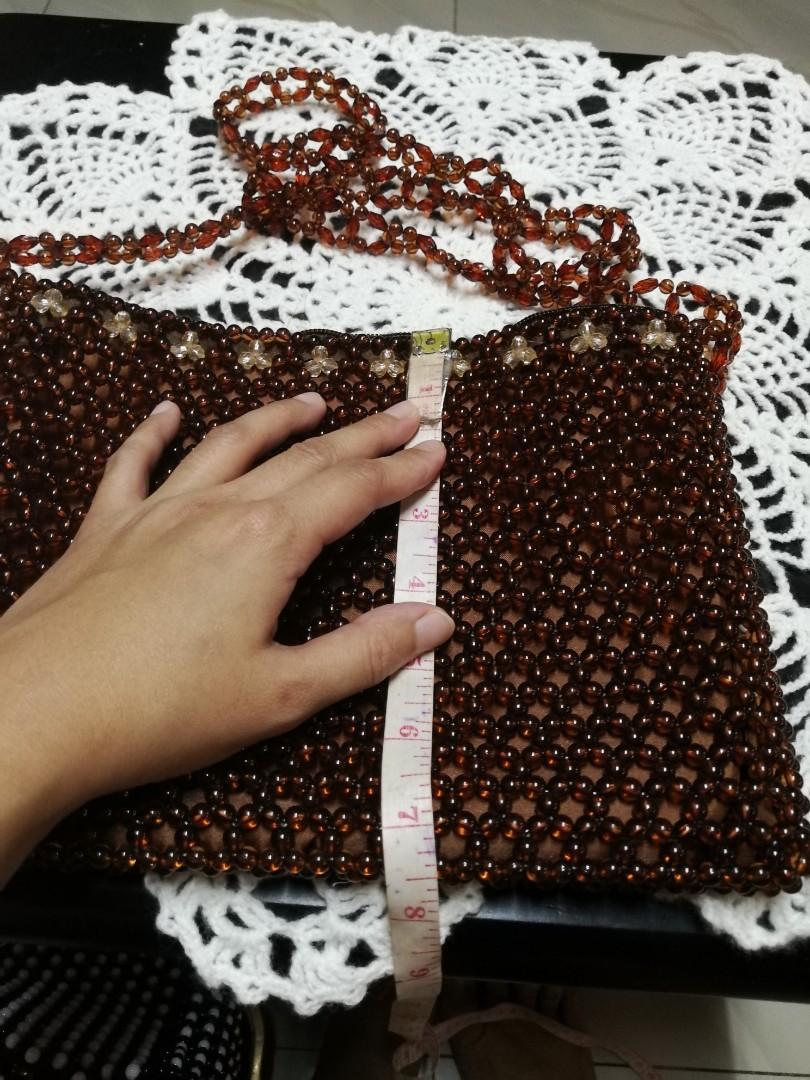 Beaded sling bag- brown (Category: Cross-body Bags) located in Taguig. Submitted by glaigee (Listing ID 1001123390, Image 3). Description: A sling beaded bag made of plastic beads, nylon with zipper. We accept MTO..