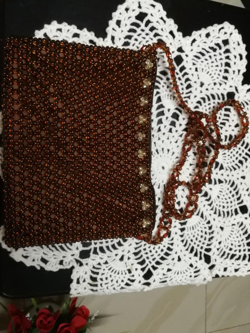Beaded sling bag- brown (Category: Cross-body Bags) located in Taguig. Submitted by glaigee (Listing ID 1001123390, Image 2). Description: A sling beaded bag made of plastic beads, nylon with zipper. We accept MTO..