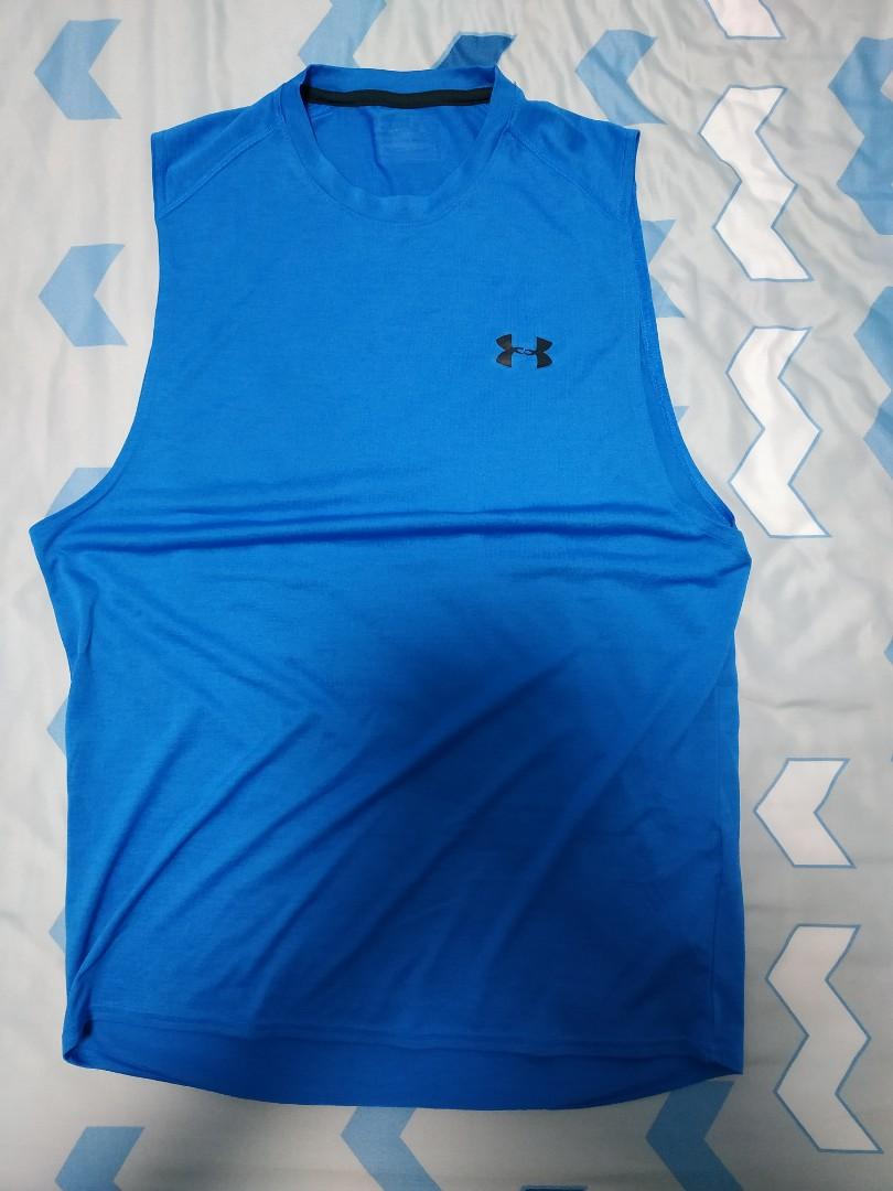 Under Armour Singlets (Category: Tshirts & Polo Shirts) located in Singapore. Submitted by storm12 (Listing ID 1001271307, Image 1). Description: Hello! This listing is for a set of Under Armour singlets. For the grey one, it's size is S and the icon has faded completely and for the blue one, it's size is M and the icon is slightly faded. Overall, besides the logo, they are still in very good condition. Prefers to meet in the east. I.e. Pasir Ris
