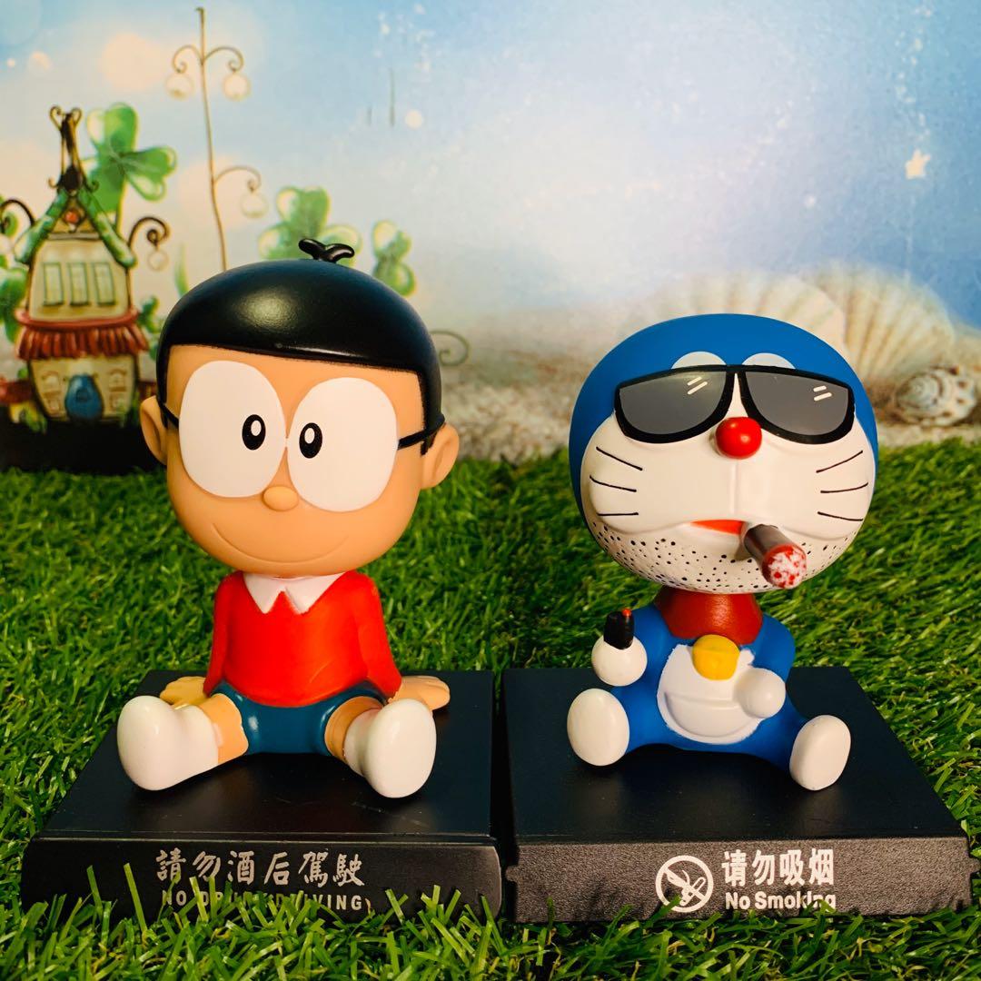 2 PCS /set Doraemon cartoon character bobble head phone holder, Hobbies &  Toys, Toys & Games on Carousell