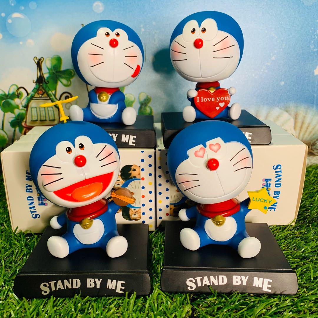 4 PCS /set Doraemon cartoon character bobble head phone holder, Hobbies &  Toys, Toys & Games on Carousell
