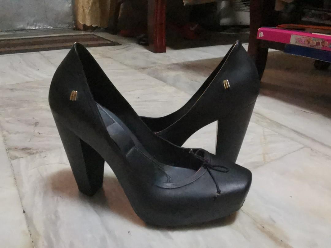 Authentic Melissa Black Platform Shoes (Category: Heels) located in Makati City. Submitted by affordstuff (Listing ID 1002579946, Image 2). Description: -Durable, Authentic, Stylish Black Melissa Shoes. -No Box anymore. -Used twice only but the size is too big for me coz I'm size 37. -4inches heels but Very comfortable since it's a platform shoes. -Can use it at school and office. -Optional: you can put a black ribbon from the sole and tie it on 