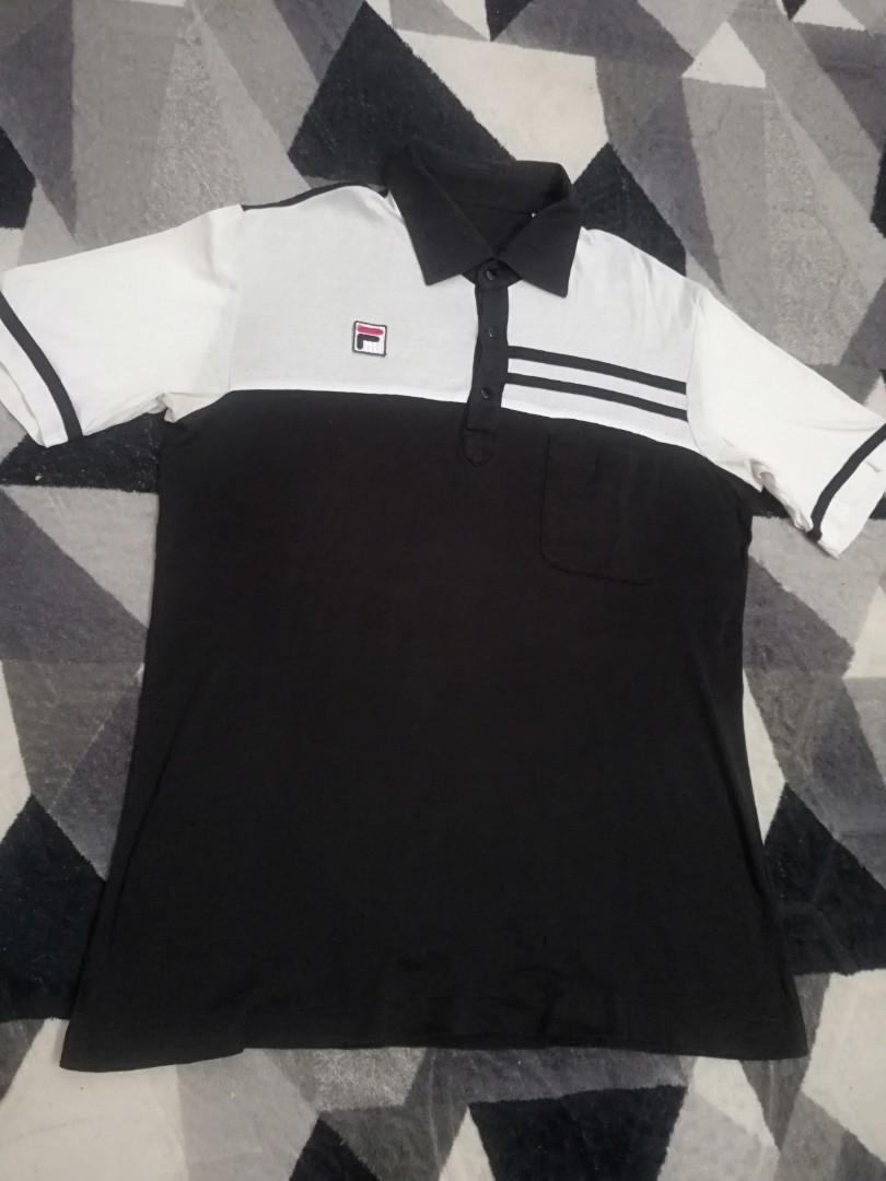 Fila snapbutton (Category: Tshirts & Polo Shirts) located in Bagan Serai. Submitted by amirasraf511 (Listing ID 1002535780, Image 1). Description: Fila black&white snapbutton Pit : 19 inch Length : 26.5 inch Tag faded/missing Price are negotiable, offer your price.