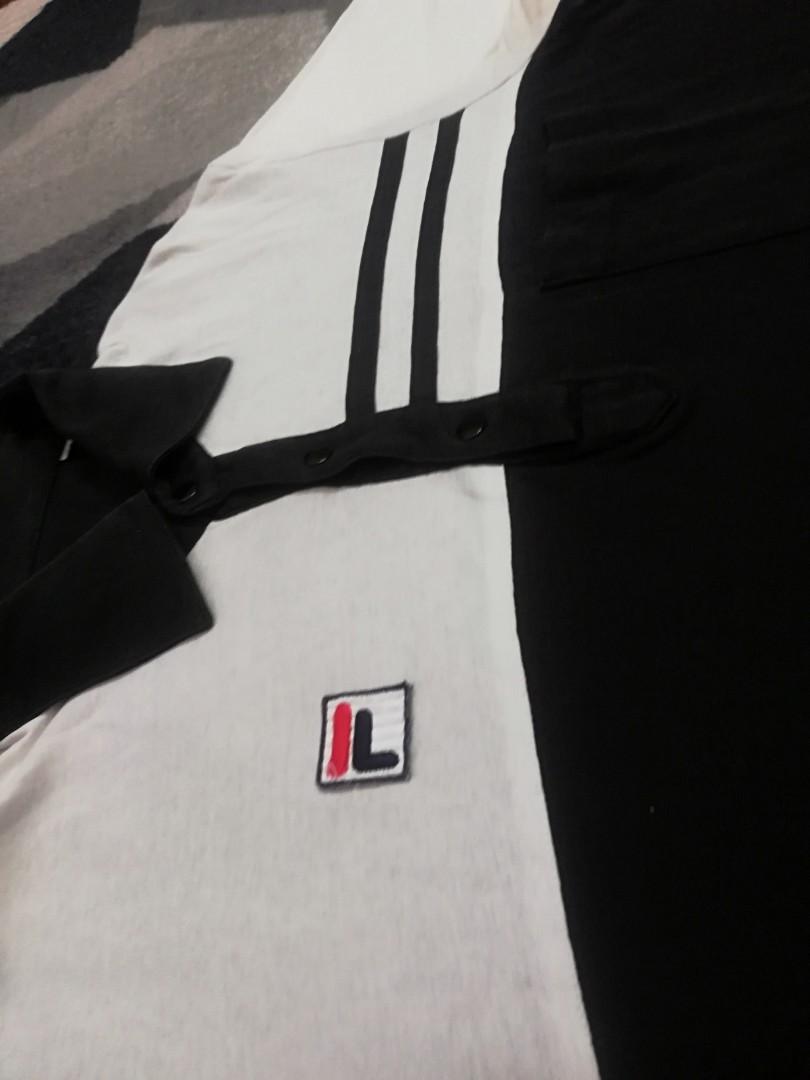 Fila snapbutton (Category: Tshirts & Polo Shirts) located in Bagan Serai. Submitted by amirasraf511 (Listing ID 1002535780, Image 2). Description: Fila black&white snapbutton Pit : 19 inch Length : 26.5 inch Tag faded/missing Price are negotiable, offer your price.