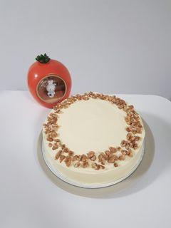 Carrot Cake with walnut & golden raisins coated with cream cheese frosting