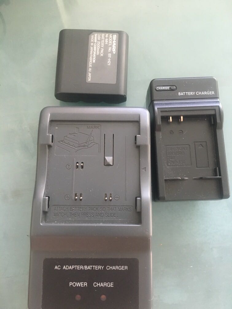 Sony/Sharp battery charger for cameras, Photography, Cameras on Carousell
