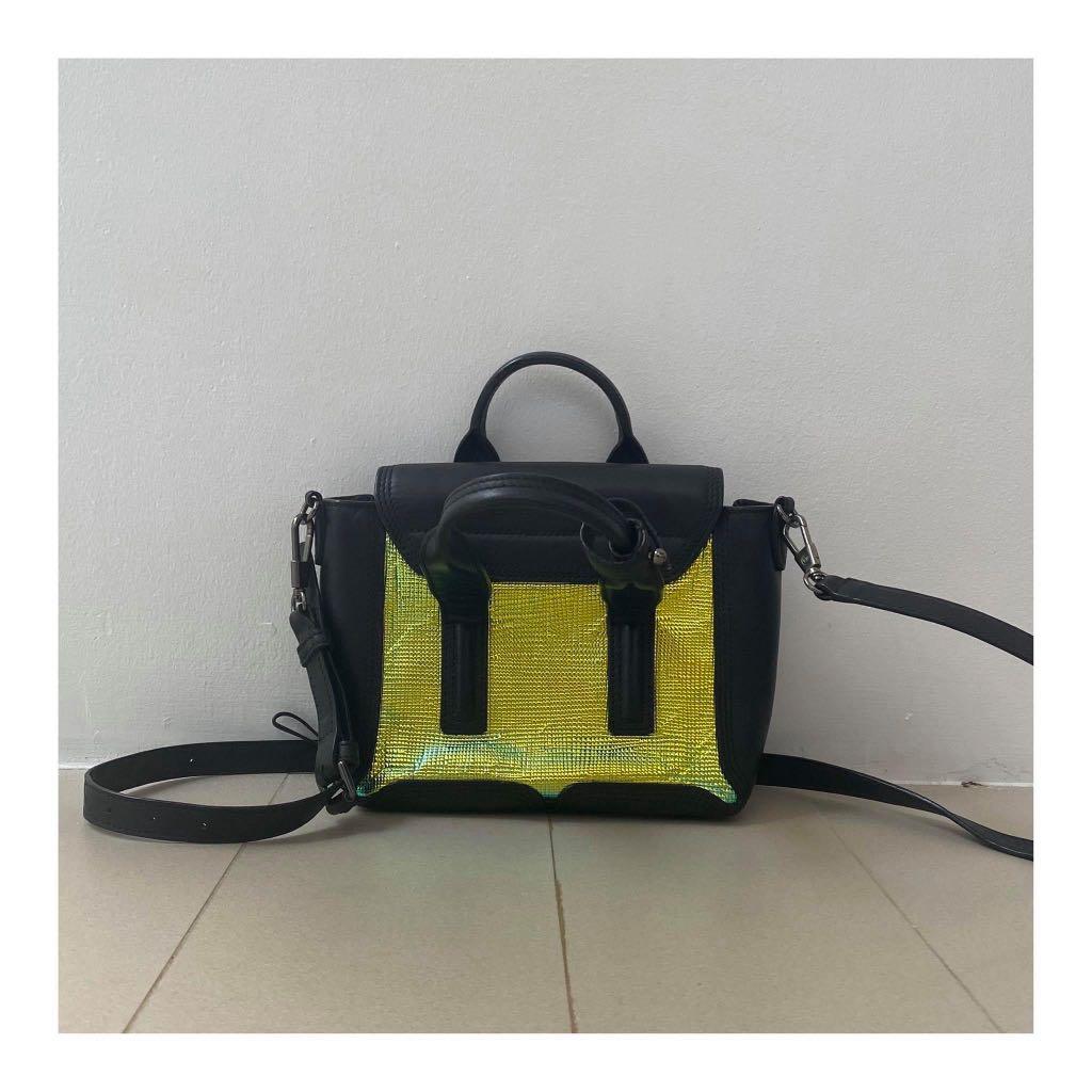 Authentic RARE Phillip Lim Holographic Micro Pashli (Category: Luxury Bags & Wallets) located in Pasig City. Submitted by sibsmnl (Listing ID 1005451151, Image 2). Description: * 100% authentic or your money back * Limited Edition * Color: Black with textured holographic stamped * Calfskin * Pre-loved * With signs of usage * A little wrinkled on the holographic material * Ranking: 8.5 out of 10 * MOP: BPI, Security Bank, GCash * SF care of buyer 
