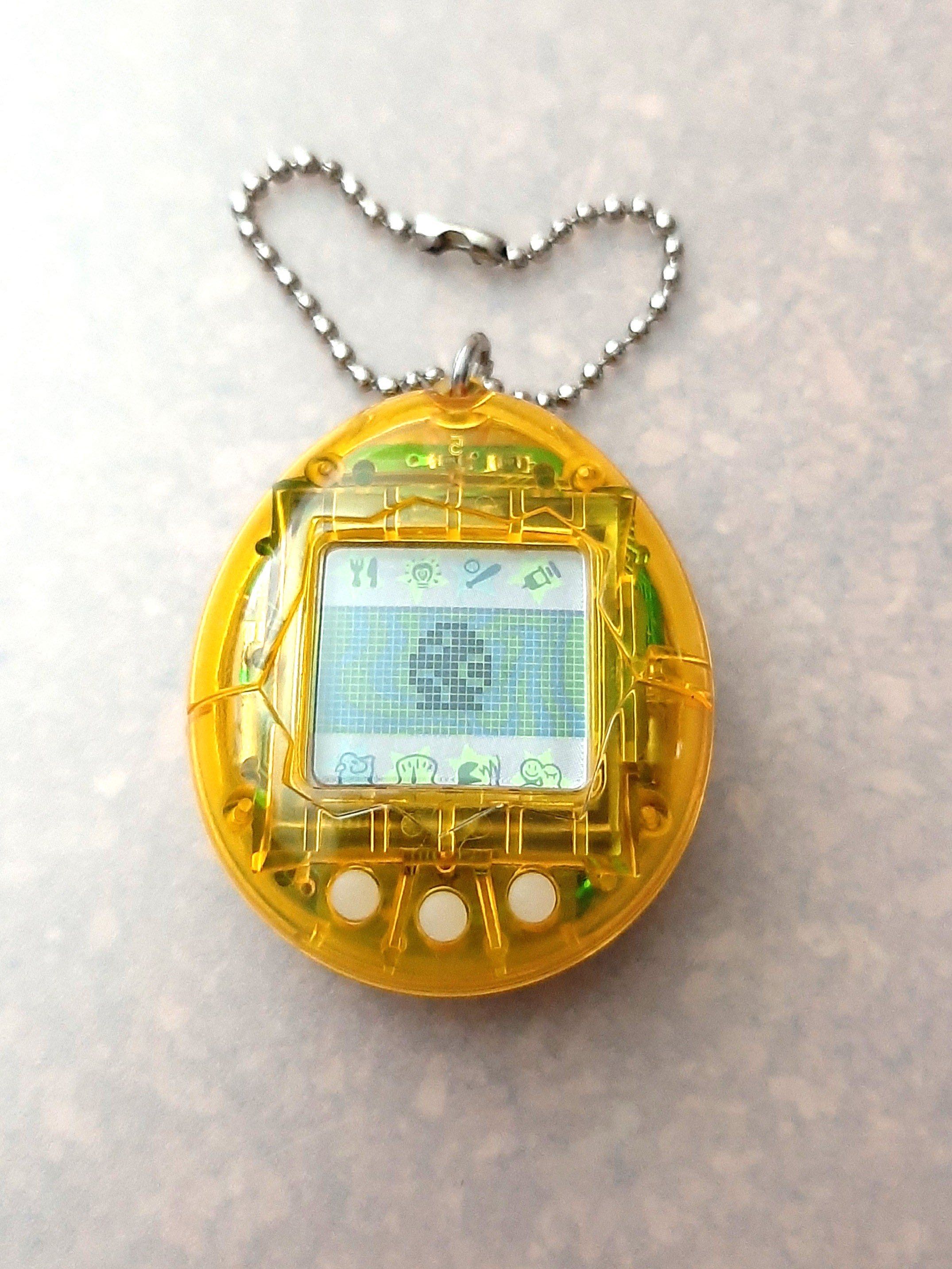 Sold" Tamagotchi  Clear Yellow P2 Version, Hobbies & Toys