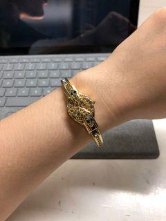 Gold snake watch