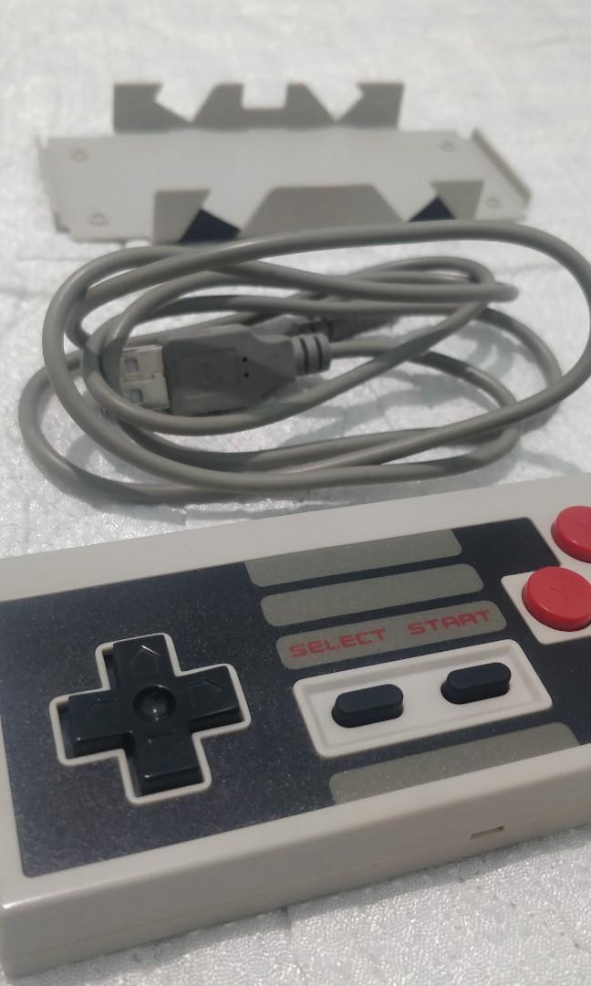8Bitdo NES30 Controller (Category: Controllers) located in Davao. Submitted by komorebi.konbini (Listing ID 1005871973, Image 2). Description: Original 8Bitdo NES30 Controller with phone stand (wired/bluetooth) for Windows, Mac, Android & IOS. No issues, barely used.