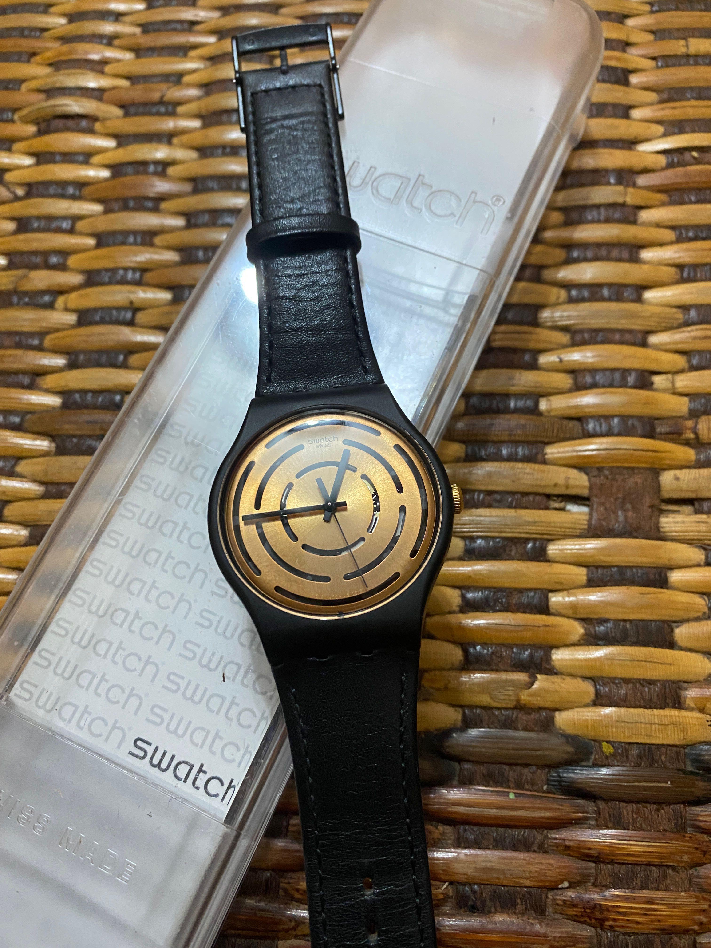 Swatch watch discount black and gold