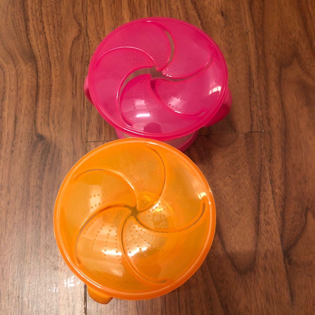 Munchkin Snack Catcher (Category: Weaning & Toddler Feeding) located in Paranaque City. Submitted by msurfer (Listing ID 1007062034, Image 2). Description: • Spill-proof toddler snack container with soft flaps for easy food access • Fits most standard cup holders in cars, car seats, strollers, etc. • Great for home, daycare or on-the-go use • Holds up to 9 ounces of snacks • BPA-free • Top rack dishwasher safe • 12+ months • Colors: Pink & Orange