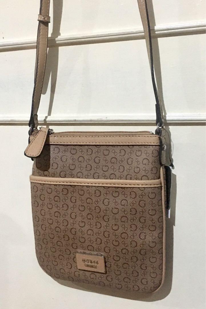 Original Guess Sling Bag (Category: Cross-body Bags) located in Quezon City. Submitted by declutter_project (Listing ID 1007200946, Image 3). Description: Color: Mocha.