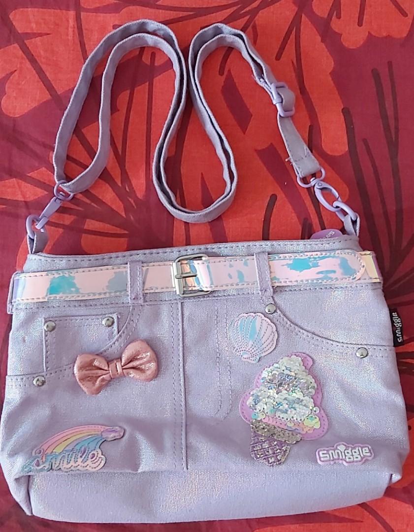 VGUC-EUC Smiggle kids cross body bag (Category: Diaper Bags & Wetbags) located in Bacoor. Submitted by sorinmarkov (Listing ID 1007103031, Image 1). Description: For Sale Only EUC-VGUC Smiggle Kids cross body bag Bought from Australia dimension: 11 x 6 1/2 x 2 1/2 inches strap length: shortest: 27inches longest: 50inches flaw: with small stain (pls see last pic) firm on price No free Sf Lalamove only MOP: BPI, BDO, Lalamove Purchase service (COD)