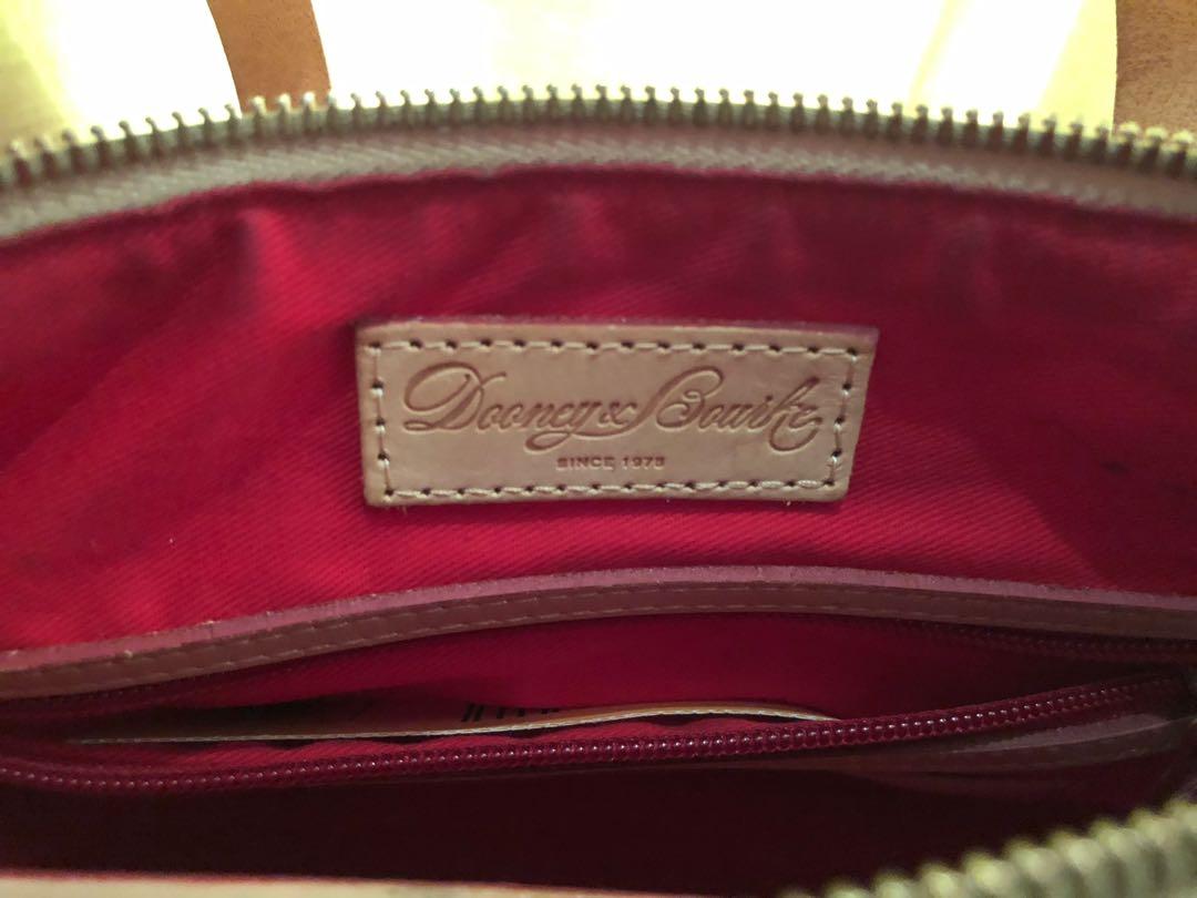 Dooney & Bourke Handbag ✨ (Category: Luxury Bags & Wallets) located in Mandaluyong City. Submitted by cambeeb (Listing ID 1007400803, Image 2). Description: Original Dooney & Bourke Handbag ✨ -NEVER been used (almost as good as new) -Minor flaws (inside) -Used as handbag or sling bag -Color: Pearl white -Bought in the U.S -Selling for P4000 + sf R.S Decluttering Don’t hesitate to message me for questions. 😊.