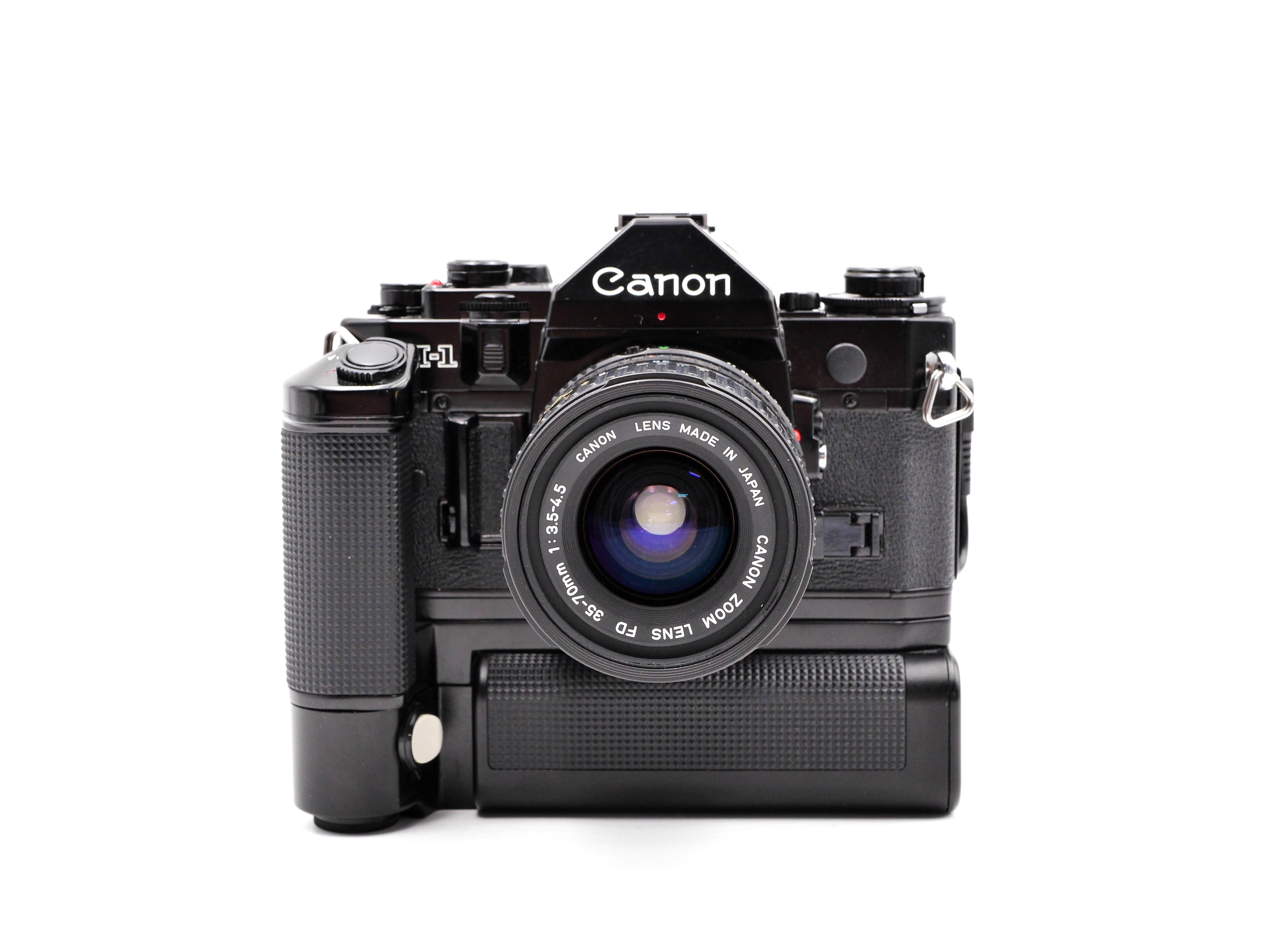 Canon A1 Film SLR + FD 3570mm +Battery Grip, Photography, Cameras on