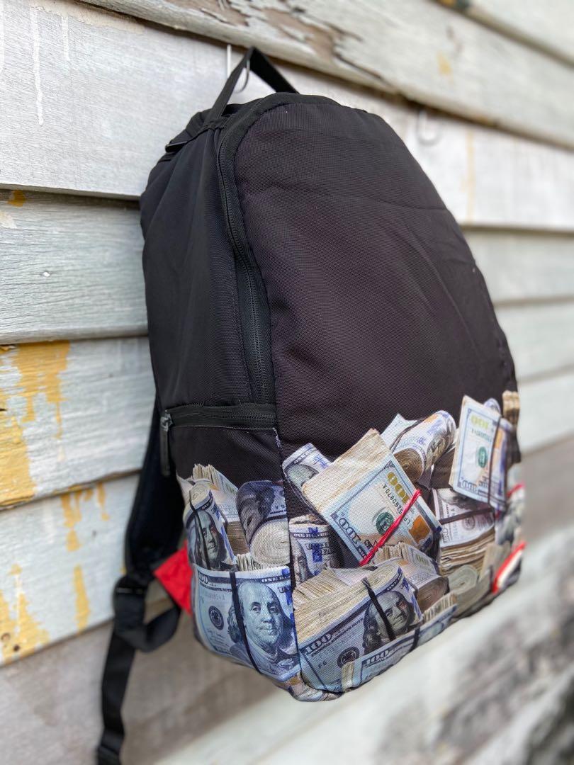 Sprayground money rolled backpack clearance