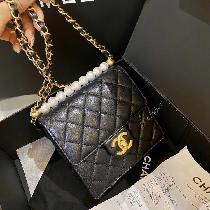 black clutch bag with gold chain