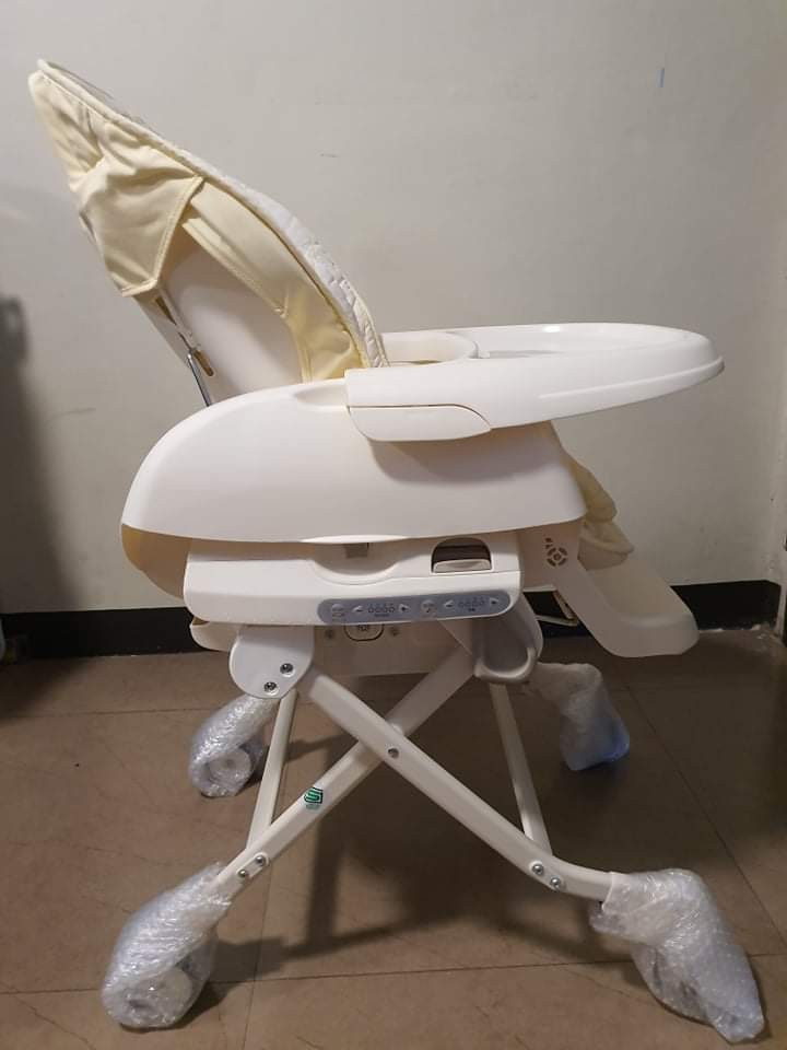 Combi swing high chair discount