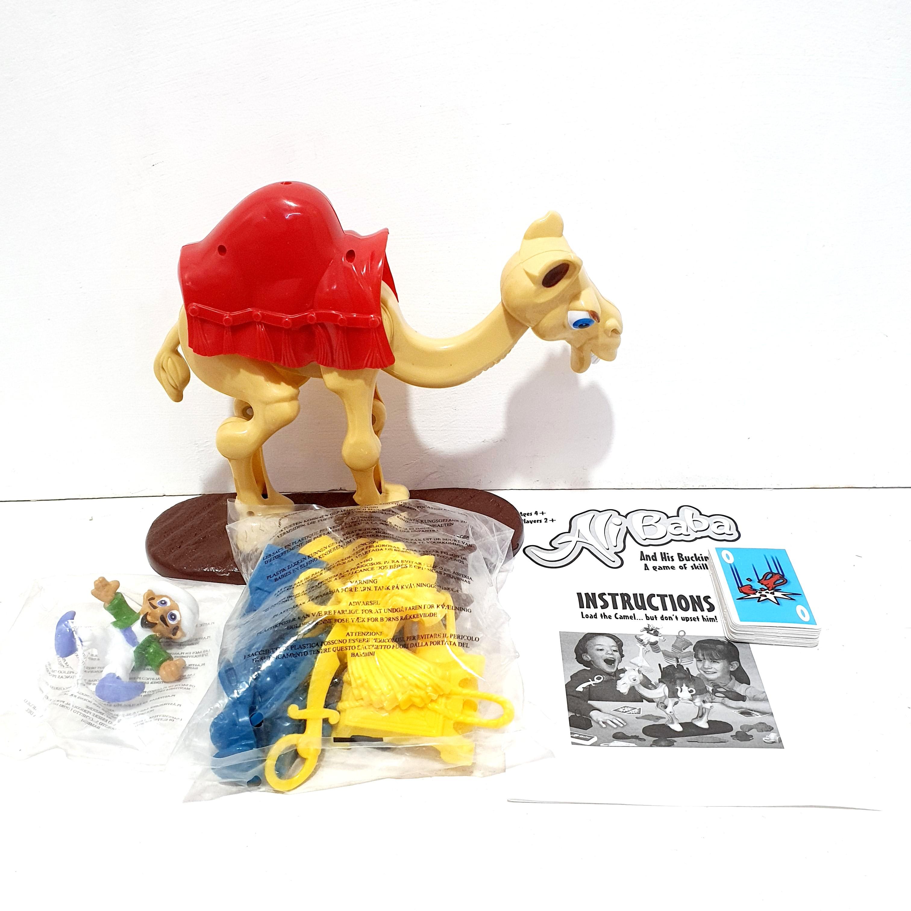 Ali Baba & His Camel (Category: Storybooks) located in Manila. Submitted by gng_gifthouse (Listing ID 1008948022, Image 2). Description: How to play? 1.Place the baggage frame on the camel's back. (An English instruction is included.) 2. Before the travel to across the dessert, Ali Baba must get his reluctant camel to SIT, and then carefully LOAD HIM UP. 3.To set the camel. push the neck and tail flmmly towards each other. The Camel will remain s
