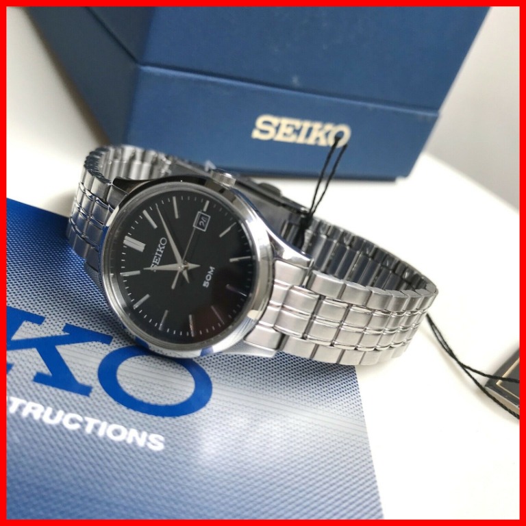 Silver watch black face top