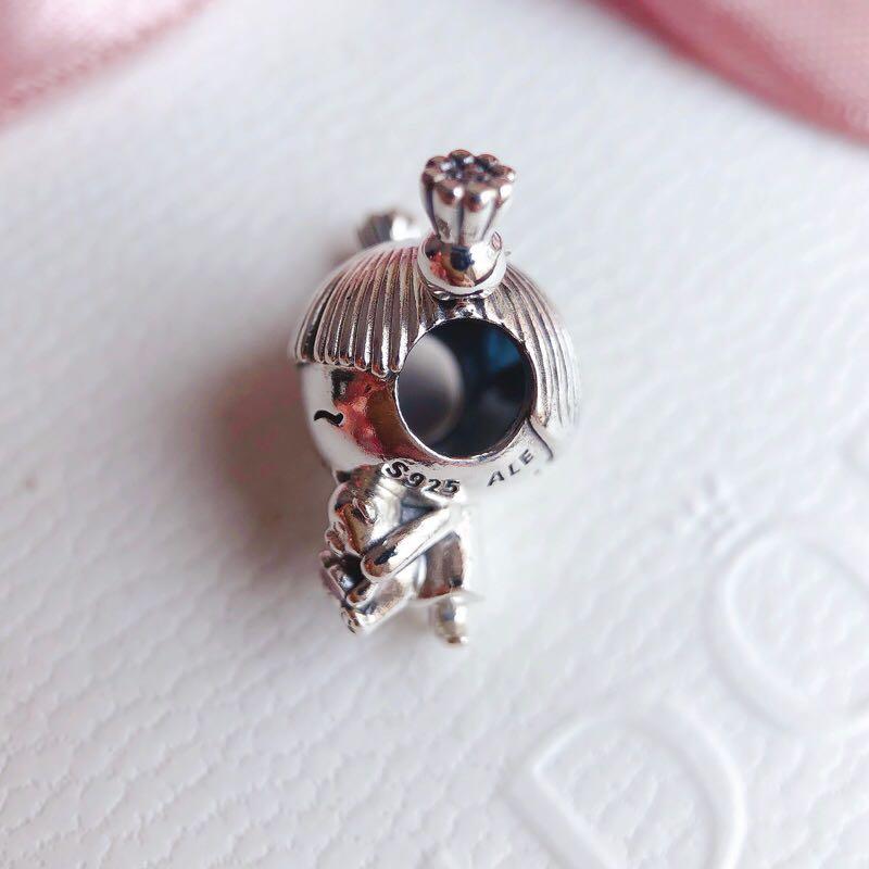 Girl with pigtails charm shop
