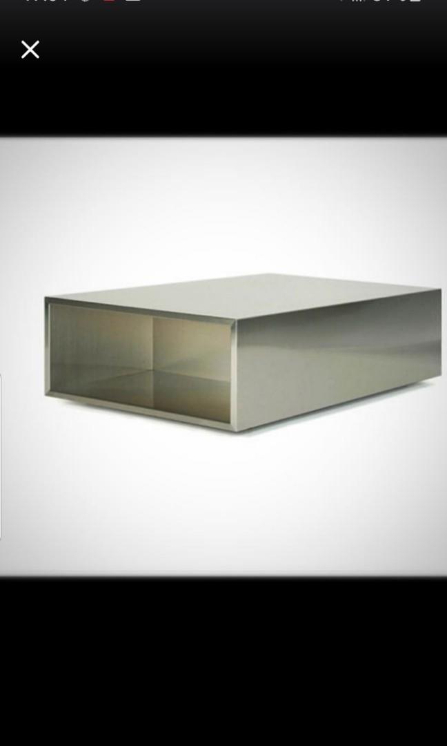 Metallic Rectangular Coffee Table (Category: Tables & Sets) located in Singapore. Submitted by luv_elle (Listing ID 1009412017, Image 1). Description: Very stylish coffee table Minimalist concept Still no heart to sell it but need space for toddler to play Dimensions 100 (L) × 60 (W) x 40 (H) Bought from air division at $1000+ Arrange own transport. Need 2 ppl 2 carry. (heavy solid piece).