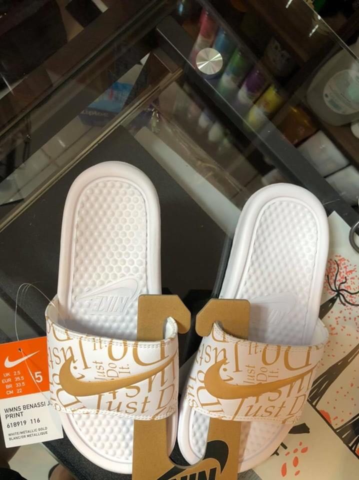 all white nike slippers