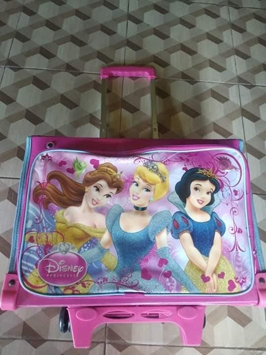Disney princess bag box type trolley (Category: Diaper Bags & Wetbags) located in Mangaldan. Submitted by est18 (Listing ID 1004104877, Image 2). Description: Good as new Bought last Feb 2020 Pinagbigyan Lang ang Bata 5 times lng nagamit dahil maxado ng bulky..
