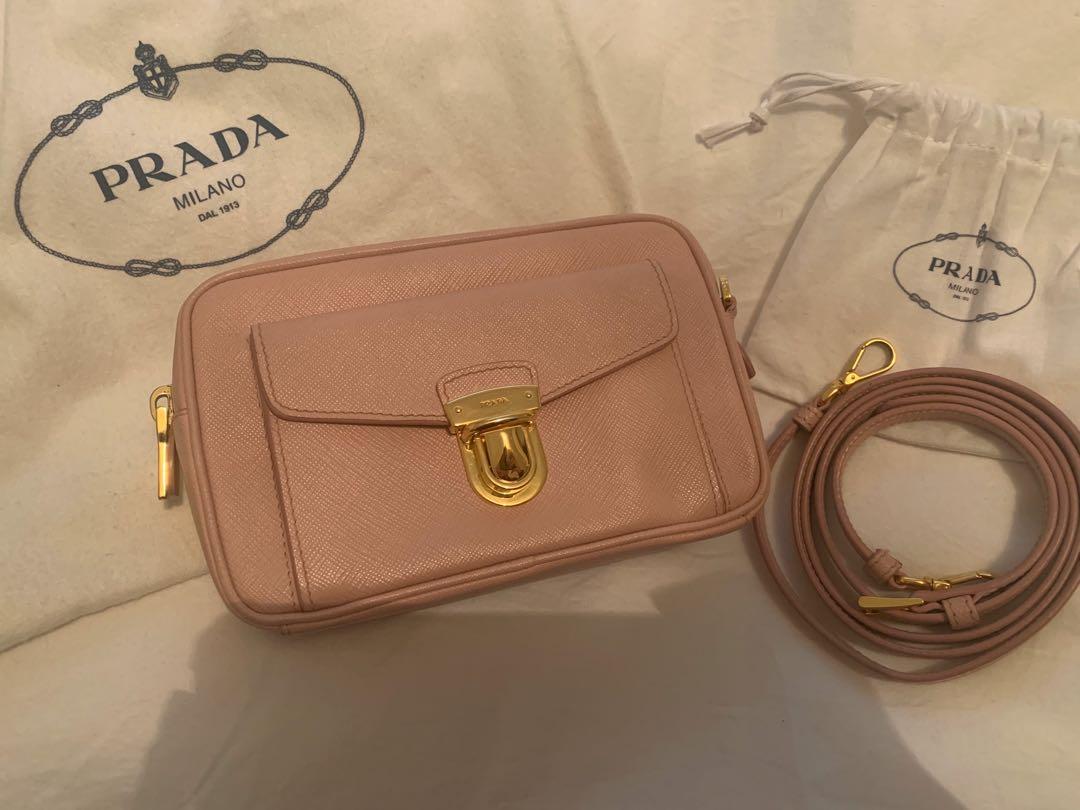 Prada Contenitor Saffiano bag (Category: Bags & Wallets) located in Brisbane. Submitted by nisumina (Listing ID 1004090471, Image 2). Description: Authentic “Contenitor Saffiano” Bought in Singapore Prada store Able to provide receipt for evidence of authenticity Lightly used Colour: orchidea (rose pink) with gold hardware Comes with detachable and adjustable sling X2 dustbags Rrp: $1280.00 .