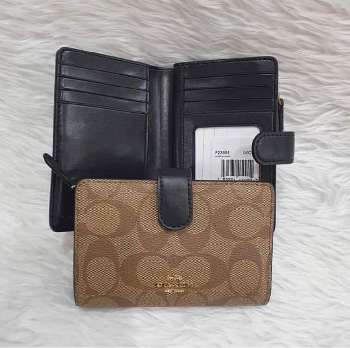 grey coach purse with purple inside